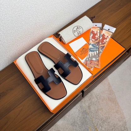 HM 26s Oran Sandal In Black And Brown Calfskin
