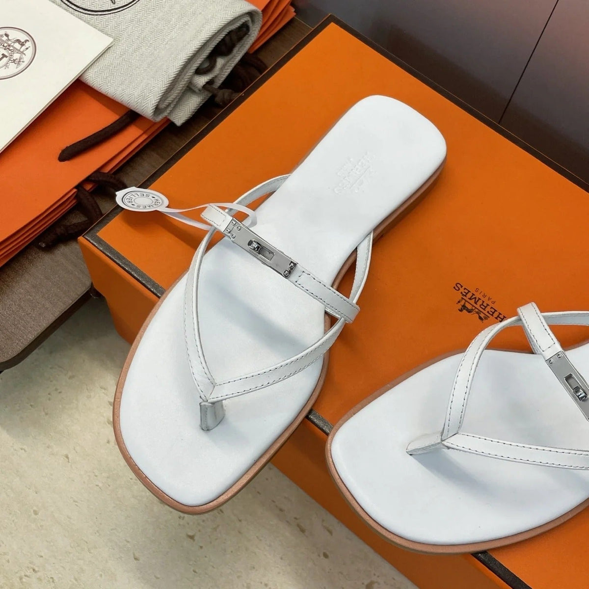 HM 26ss Kelly Sliver Buckle Slipper White Calfskin 607159